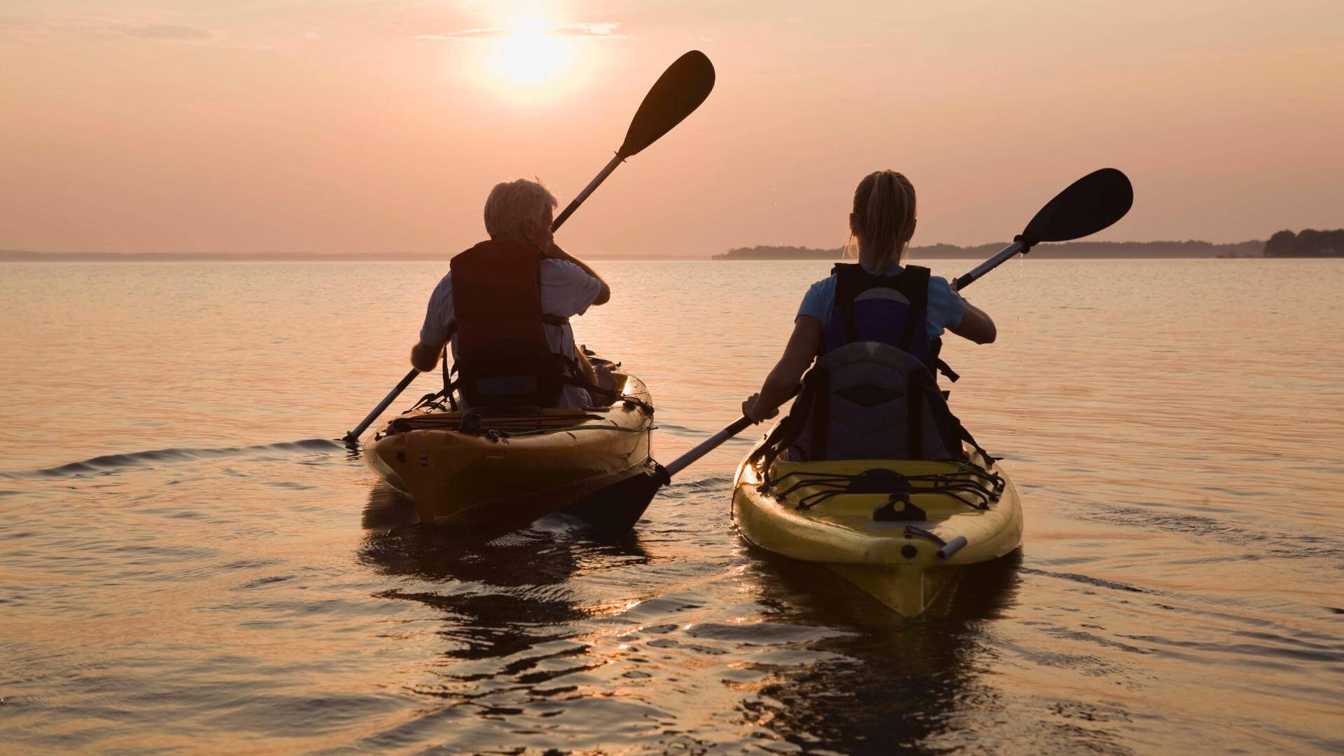 couple doing kayak in mexico puerto escondio in the ocean along the coast line