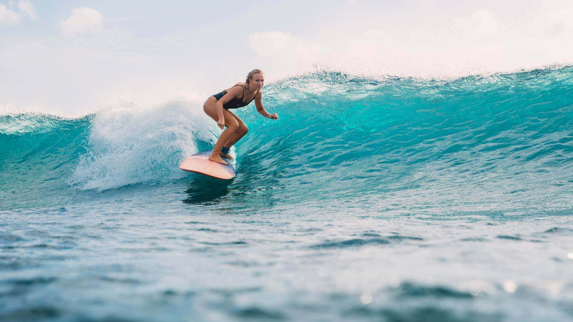 girl who's surfing a very good wave in puerto escondido mexico